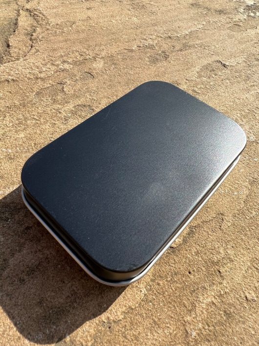 handmade portable palette with a black tin