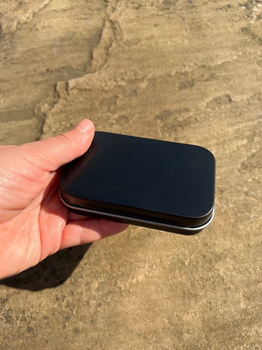 handmade portable palette with a black tin
